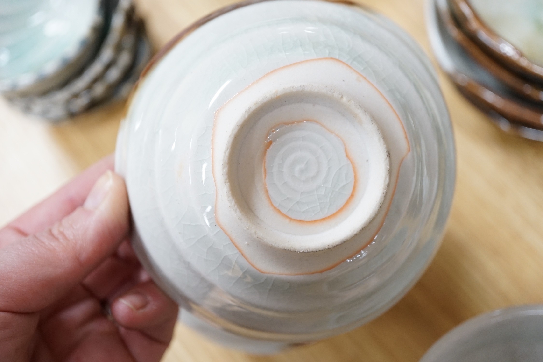 A group of Japanese studio pottery bowls, shell dishes, plates and a teapot, approx 53 pieces